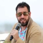 Adam Sandler performing at TD Garden in Boston during his 2025 comedy tour