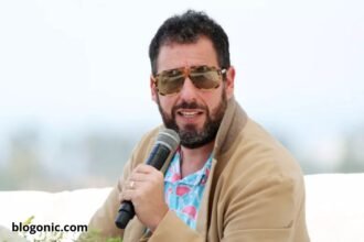 Adam Sandler performing at TD Garden in Boston during his 2025 comedy tour