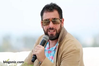 Adam Sandler performing at TD Garden in Boston during his 2025 comedy tour